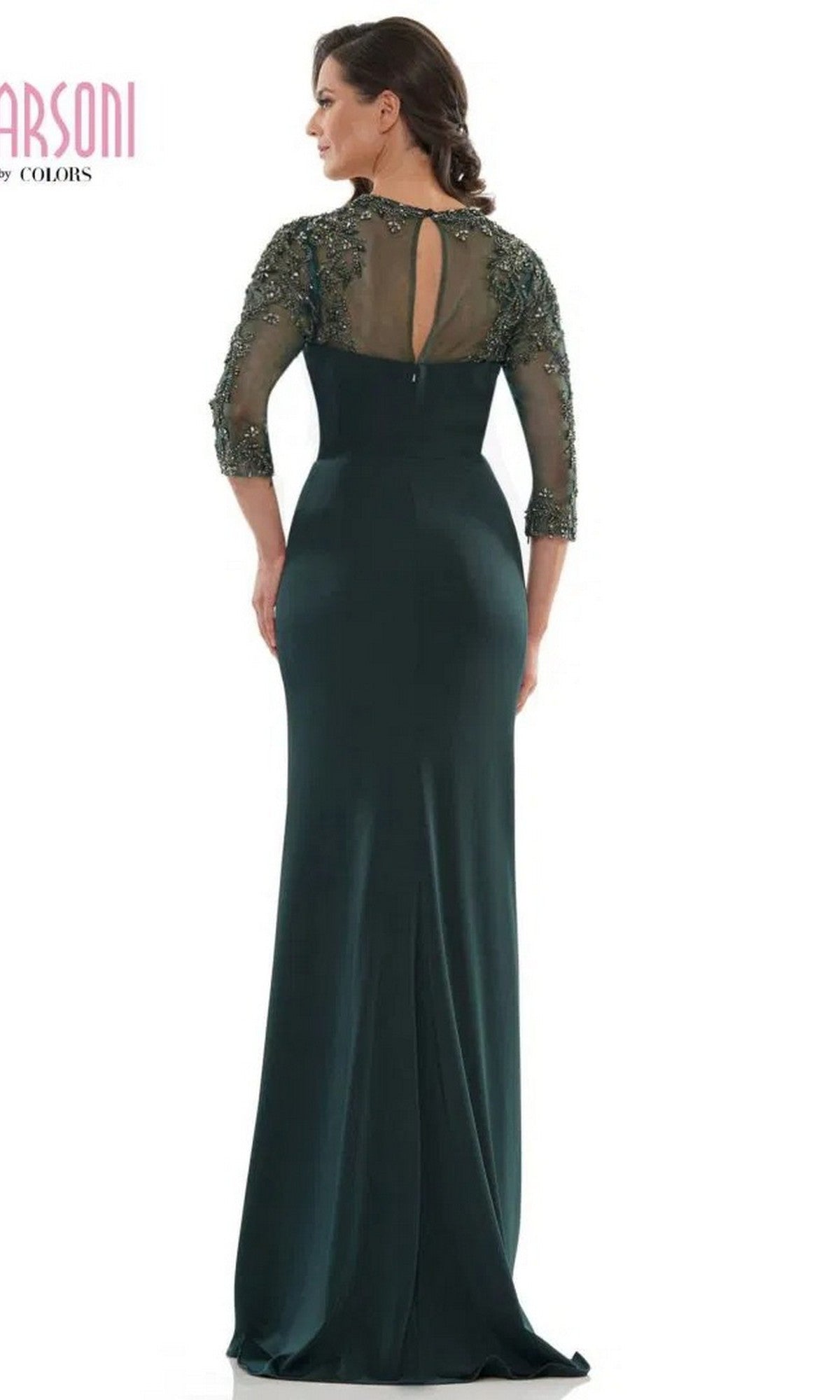 A woman models the Marsoni MV1070, a floor-length dark green formal dress featuring a column skirt and beaded sheer sleeves and back, with her back to the camera.